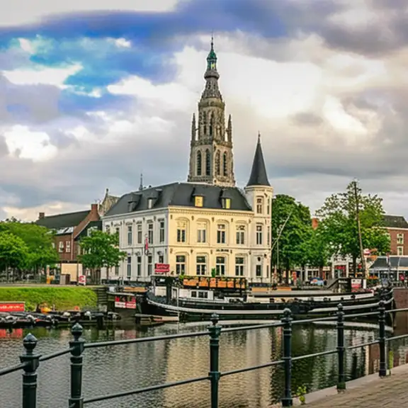 Een rivier met een brug en een kerk in Breda op de achtergrond. Prachtig landschap met historische architectuur.